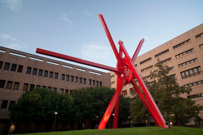 A large red metal sculpture