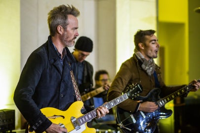 guitarists playing music