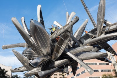 cluster of canoes with blue sky in background