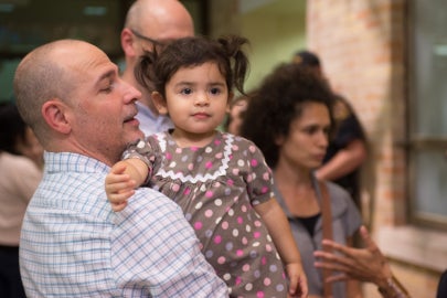 A man holding his infant daughter