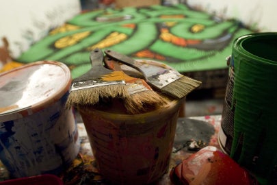 paintbrushes on paint can