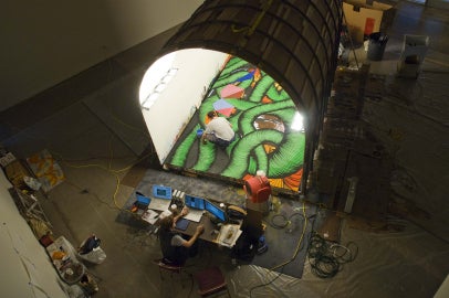 person painting inside space