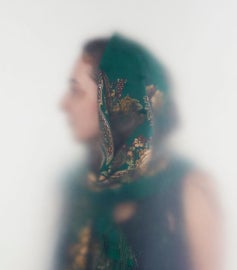A woman wearing a head scarf