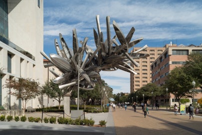 outdoor sculpture made out of canoes