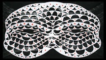 white shaped mask on black background