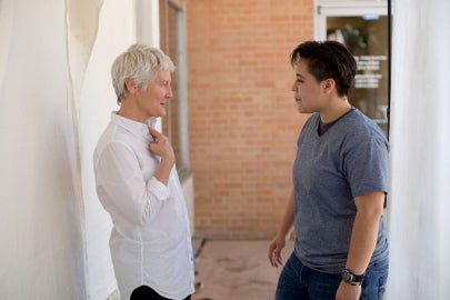 A woman talking to another person