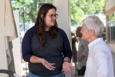 A woman talking to a man