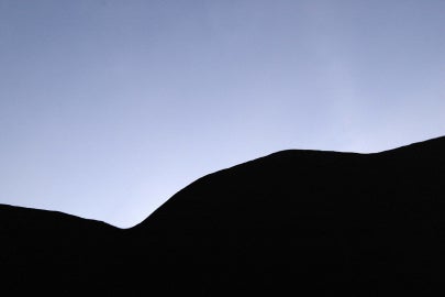 curvy shadow shape below sky