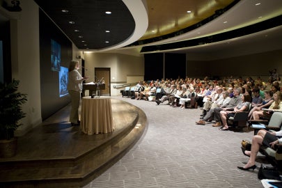 woman speaking to audience