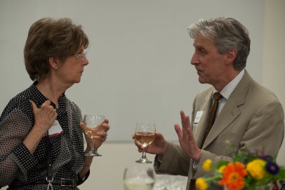 two people facing each other and talking