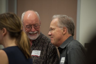 a person looking at another person and laughing