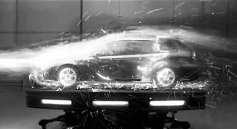 blurry black and white car on platform