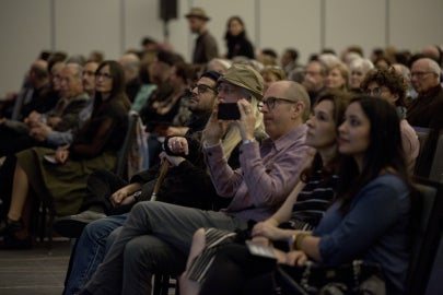 Group of sitting people looking in same direction