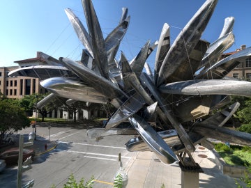 canoe cluster with building, street and sky in background