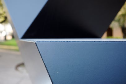 5 black flat surfaces coming together at a 45 angle