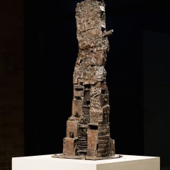 A tall sculpture on a pedestal