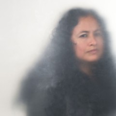 A woman with wavy black hair
