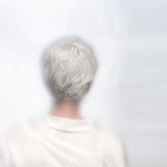 A woman with shirt grey hair