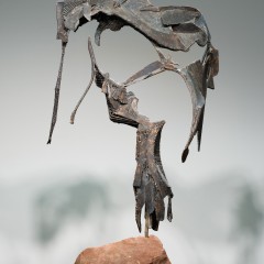 A sculpture mounted on a rock