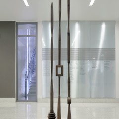 Tall sculpture with three large vertical poles