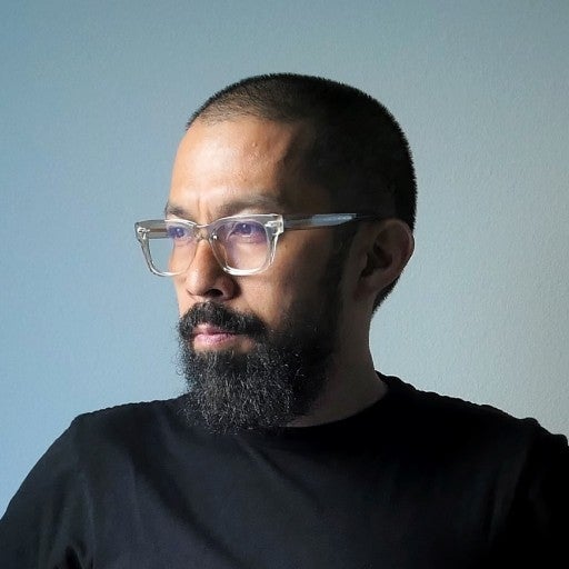 A headshot of DJ Mel