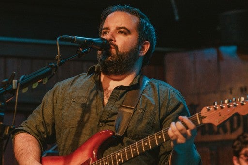 A photo of musician Brian Wolff performing