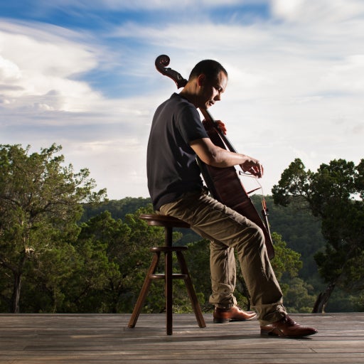 A man plays a cello outside 