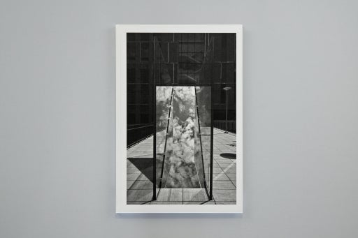 A black and white book against a gray background