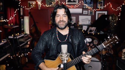a man holds a guitar 