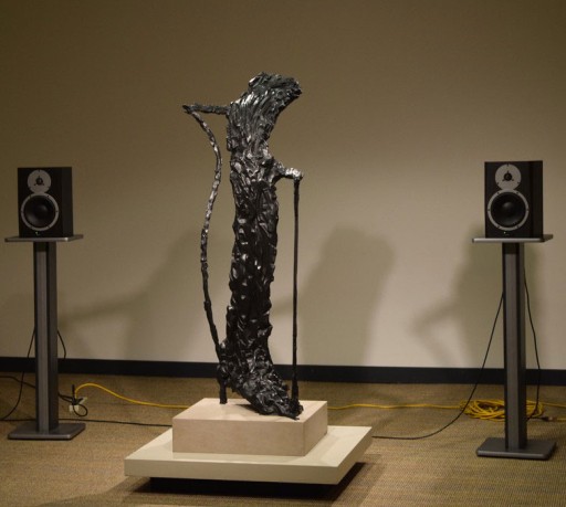 A sculpture with speakers on either side