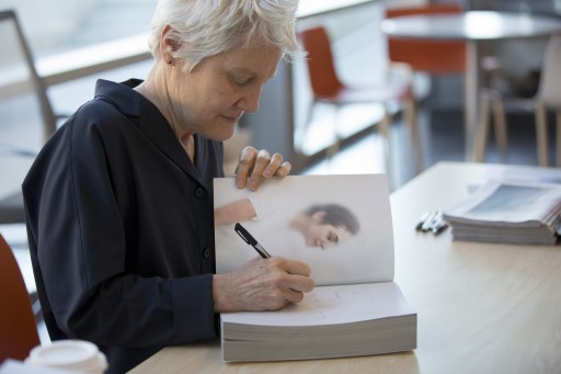 Artist Ann Hamilton signing a book