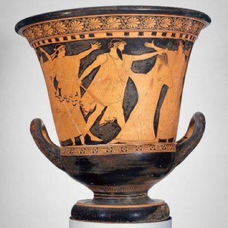 An ancient pot with a bearded figure