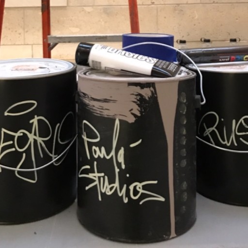Paint cans in artist studio