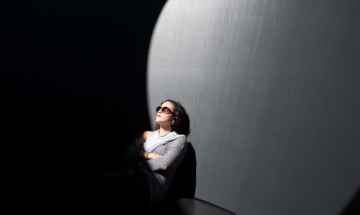 woman in skyspace with sunglasses