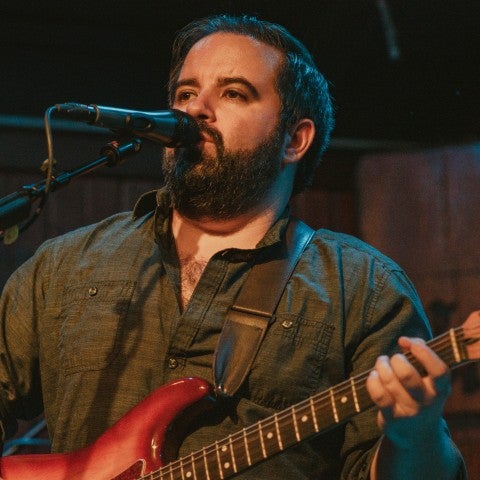 A photo of musician Brian Wolff performing