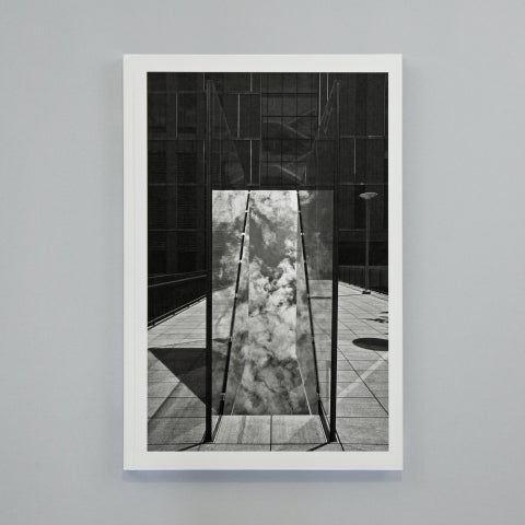 A black and white book against a gray background