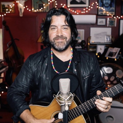 a man holds a guitar 