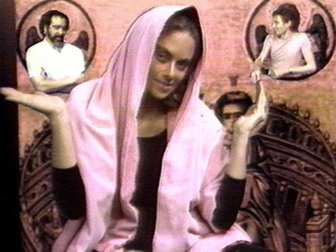 Hermine Freed, Art Herstory, 1974 A woman in a shawl shrugging her shoulders