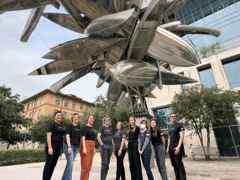 A group photo of Landmarks Staff in front of Nancy Rubin's sculpture, "Monochrome for Austin"