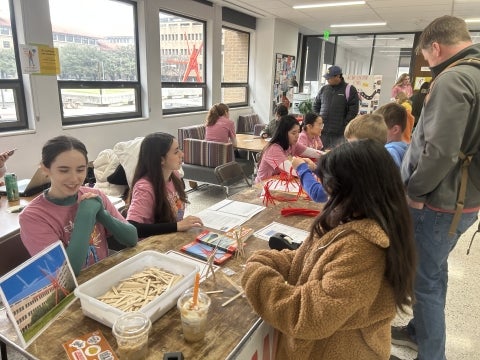 A photo of volunteers and visitors during UT Austin's Girl Day.