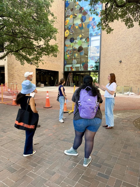 docents gather in front of "Autobiography: Circles"