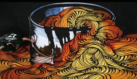 David Ellis, Animal, 2010 A man painting a large shiny bucket with long colorful pasta flowing out