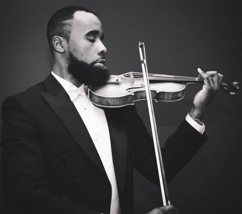 A black and white photo of Shawn LeSure playing Violin. 