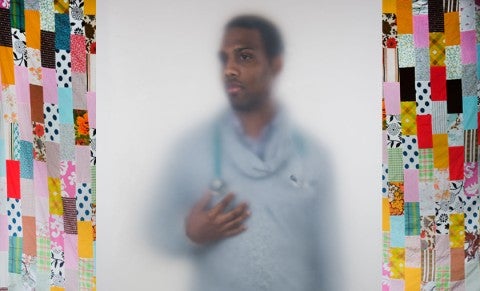 image of doctor with quilted panels on either side image of doctor with quilted panels on either side