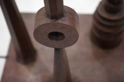 photo by Ben Aqua circular brown shape with other shapes behind it